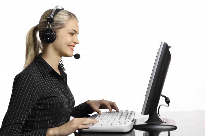 technology-woman-with-headset-at-computer-small_1